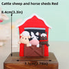 Red farm animal cake topper featuring a cattle sheep and horse in a wooden shed display