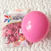 A pink latex balloon packaged for party decorations