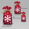 Three festive red drawstring gift bags in L, M, and XL sizes featuring white snowflake patterns.