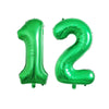 Two shiny green foil number balloons shaped like 1 and 2 for birthday party decor