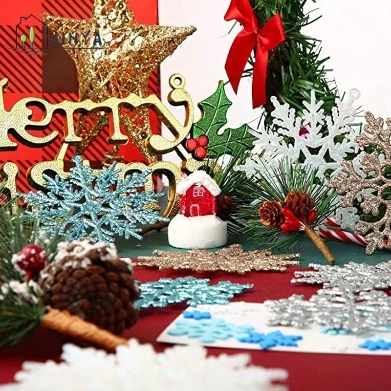 A collection of six shimmering blue snowflake ornaments and gold lettering on a red background.