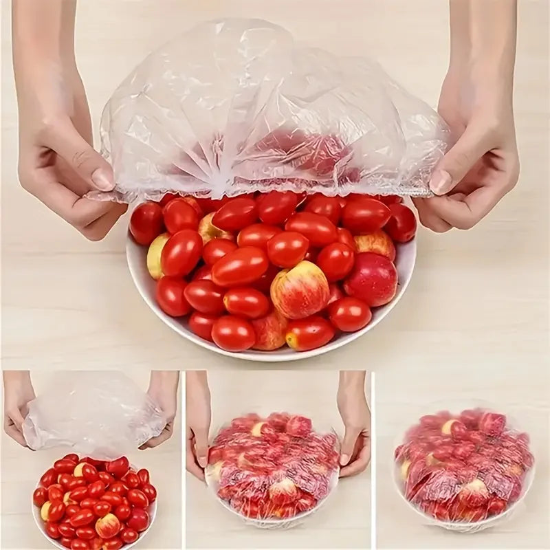 Hands holding a clear reusable food storage bag filled with fresh red tomatoes and apples.