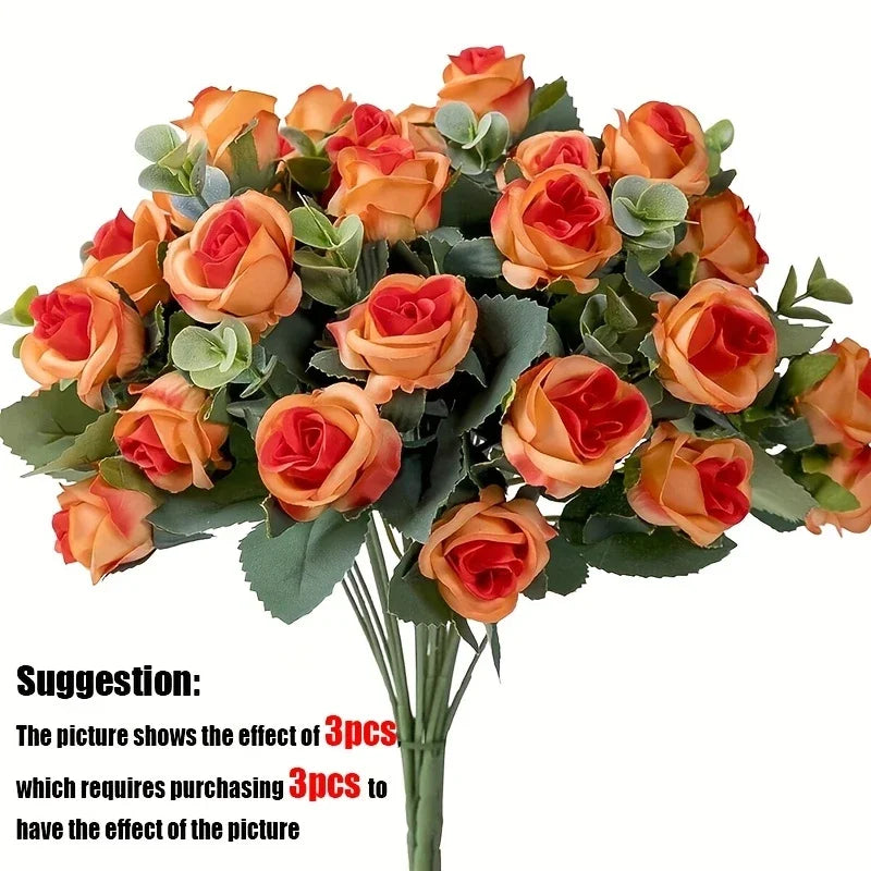 A bouquet of silk orange roses and eucalyptus leaves for wedding or home decor.