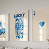 A set of three framed art prints featuring lucky hearts and the word you