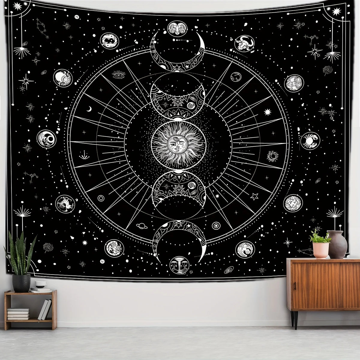 A dark tapestry featuring a celestial sun and moon design with zodiac art against a starry background.