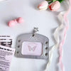 Silver lace PU card holder with a pink bow ribbon keychain resting on a white background.