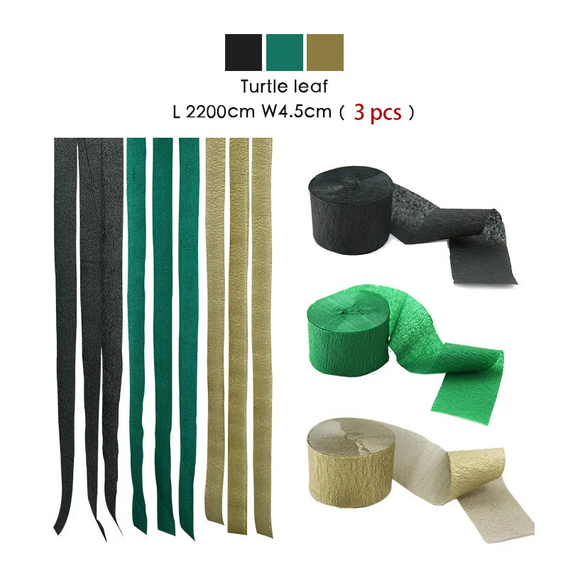 Set von drei Schildkröttenblatt-farbenen Crêpepapier-Girlanden in schwarz, grün und gold.