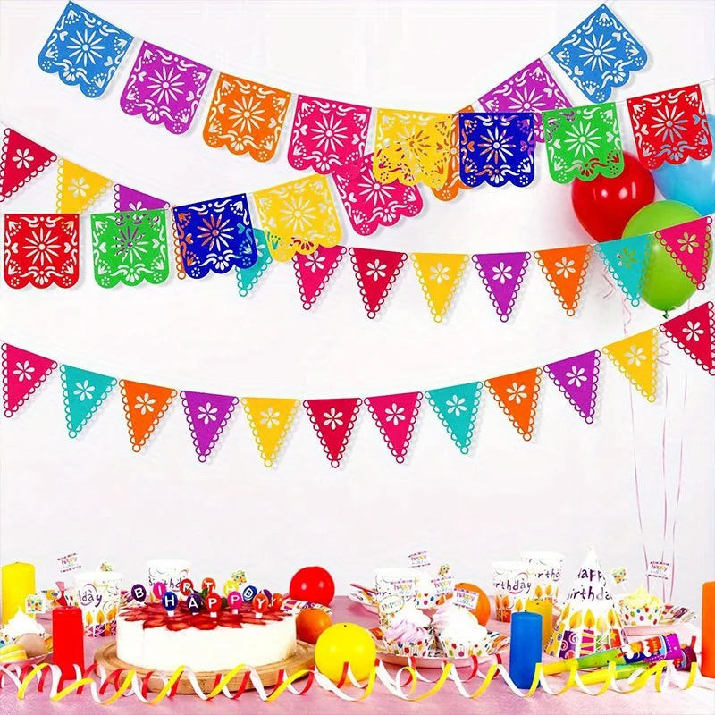Colorful felt papel picado banners strung across a white background for festive celebrations