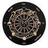 A round wooden divination board with a central sun design and directional words like YES, MAYBE, WAIT, NO, NOW, REPHRASE.