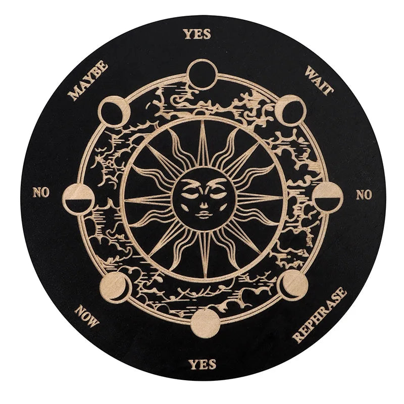 A round wooden divination board with a central sun design and directional words like YES, MAYBE, WAIT, NO, NOW, REPHRASE.