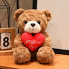 A fluffy brown teddy bear with a red heart attached, representing a romantic gift.