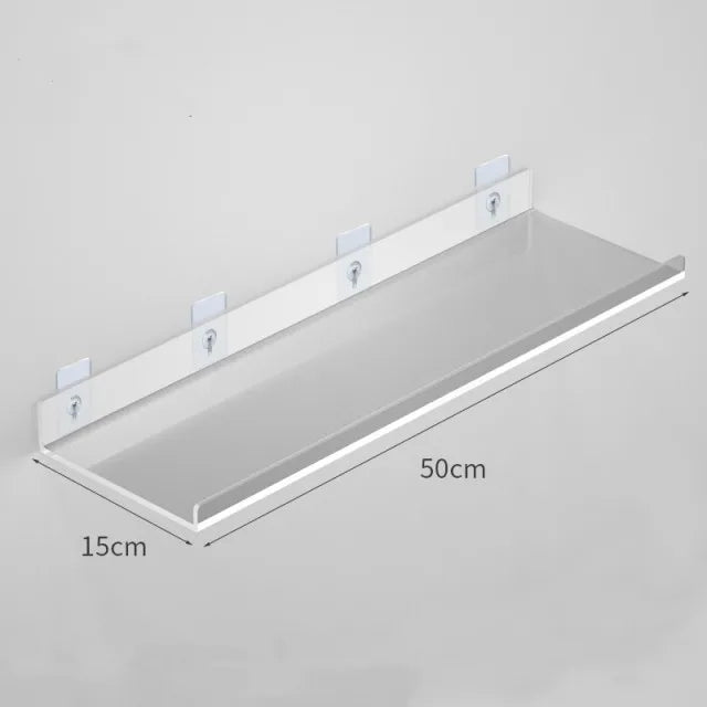 A clear acrylic floating shelf with wall mounts shown in a top-down view.