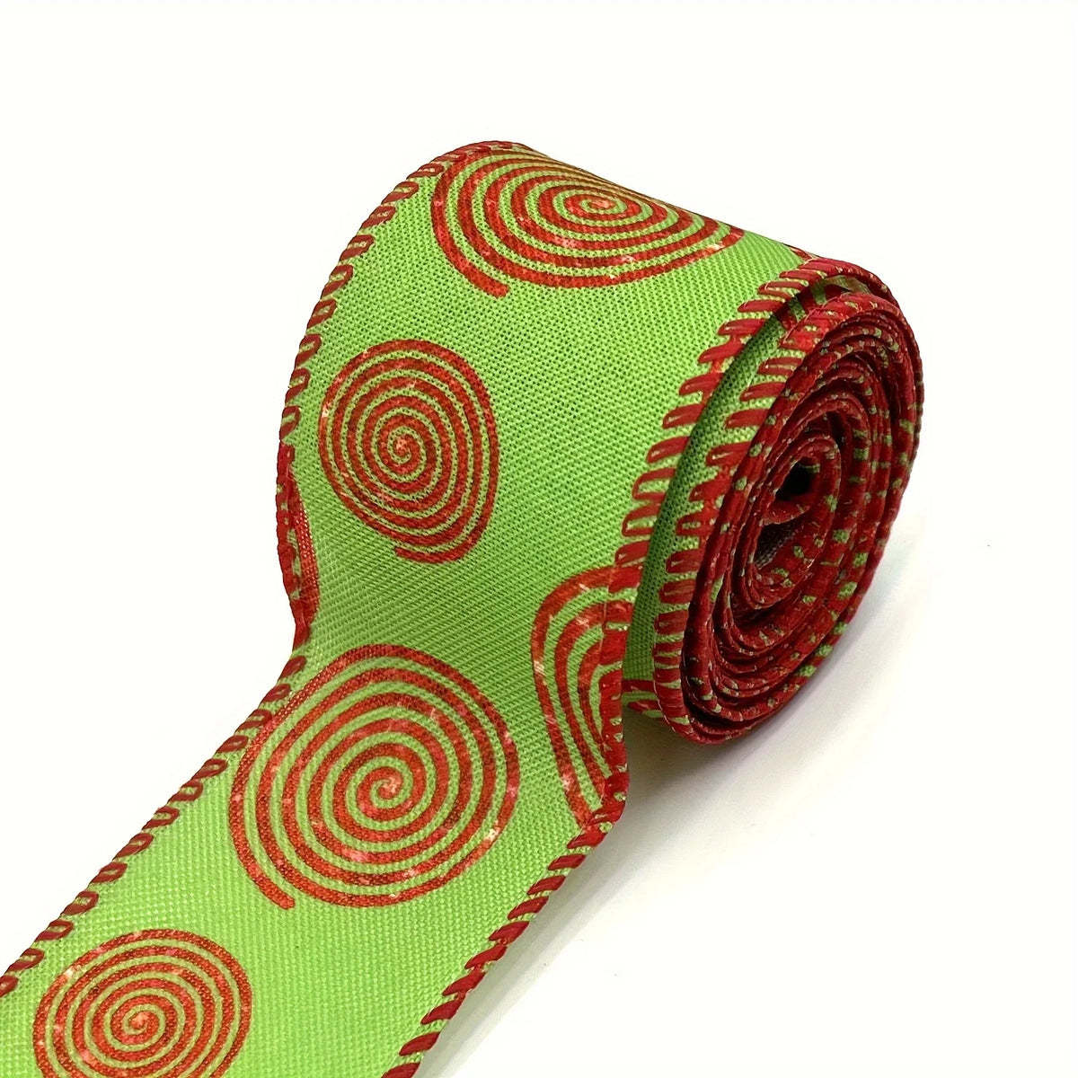Green burlap ribbon with red spiral pattern and wired edges for crafting or wrapping.