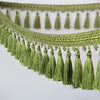 Green decorative tassel fringe trim used for curtains and DIY projects