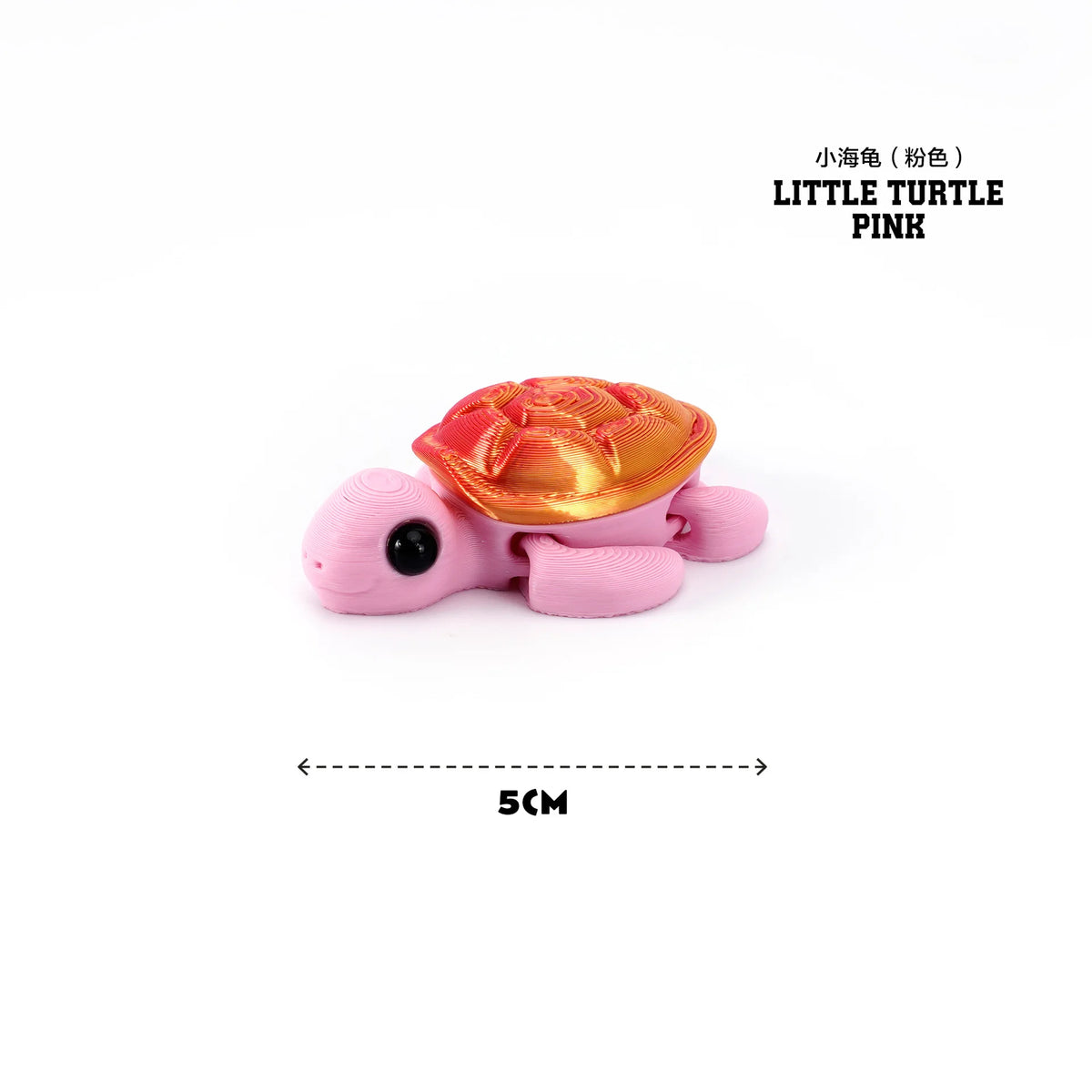 Pink little turtle figurine with a golden shell, 5cm long.