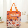 Orange Halloween trick or treat party tote bag featuring a cloud pattern with bats and pumpkins