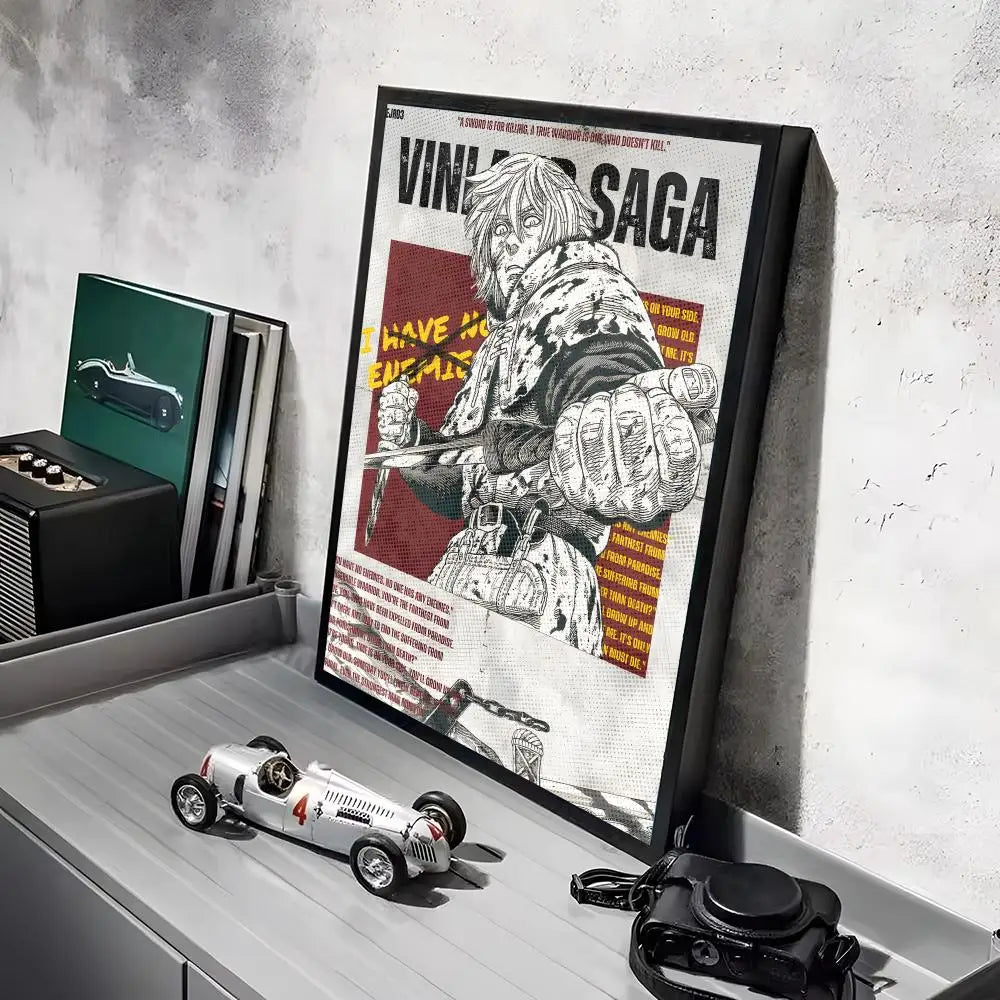 A framed poster of the Vinland Saga anime featuring a character in battle, displayed on a shelf.