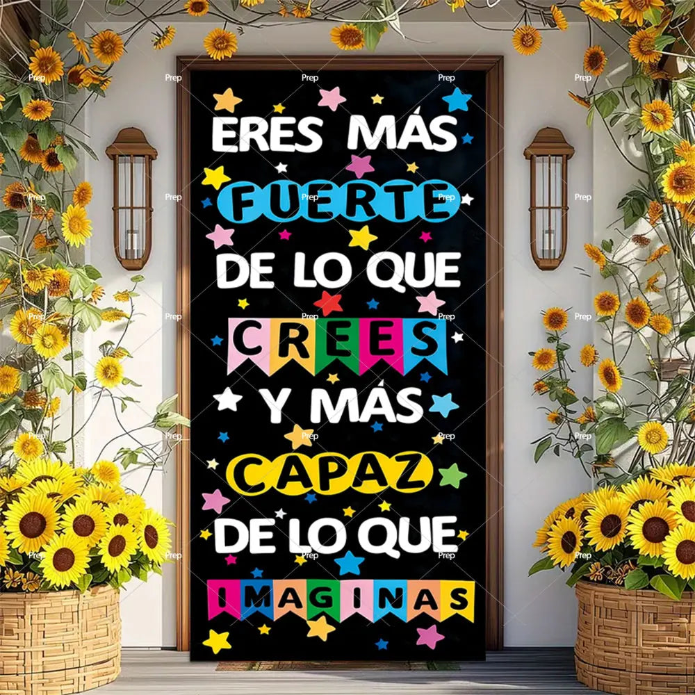 A dark chalkboard door banner decorated with colorful text that readsEres Más Fuerte de lo que Crees y Más Capaz de lo que Im