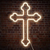 A glowing white neon cross sign mounted on a dark brick wall.