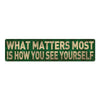 A rectangular metal sign with gold lettering on a dark green background that reads What matters most is how you see yourself