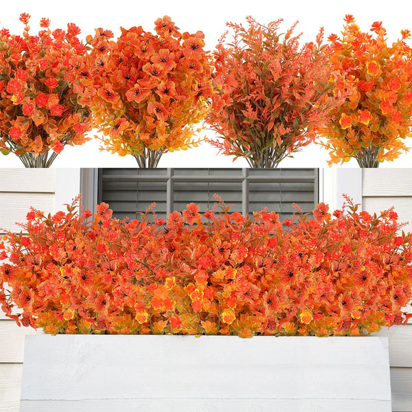 Two artificial fall eucalyptus and flower stems in vibrant orange and red hues displayed in outdoor planters.