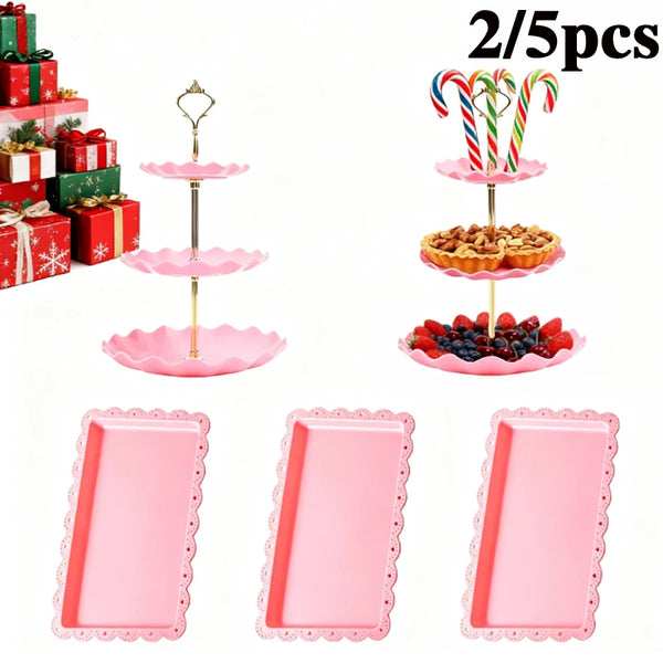 Un juego de cinco estantes de postres de tres niveles rosas y bandejas individuales rosas para fiestas de té