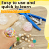 A hand holds a colorful stress ball, surrounded by various beads and crafting tools for making DIY stress relief trinkets.