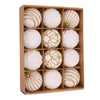 A box containing twelve white velvet Christmas hanging ornaments, some covered in gold glitter.