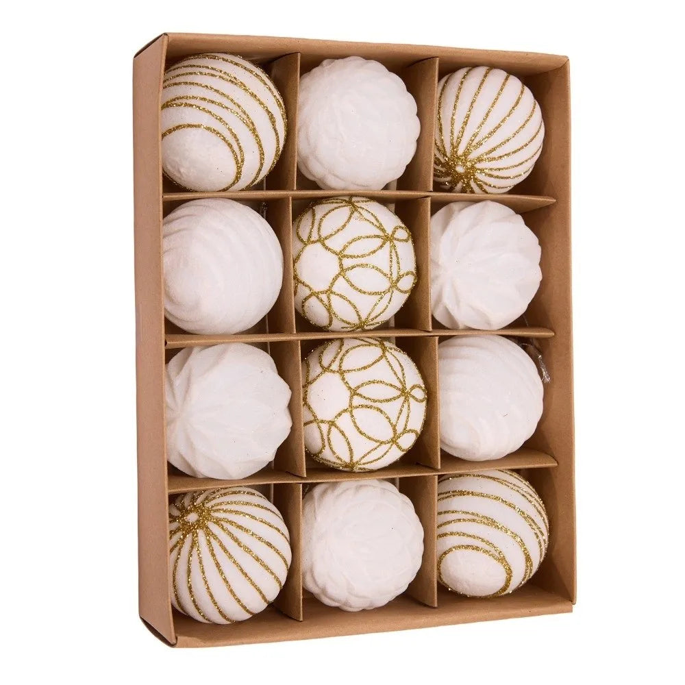 A box containing twelve white velvet Christmas hanging ornaments, some covered in gold glitter.