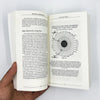 An open page from a literary fiction book titled Becoming Supernatural showing text and illustrations.