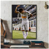A framed poster of Neymar Jr in a white jersey celebrating on a football field.
