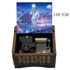 A wooden music box featuring an illustration of a Detective Conan character against a city skyline.