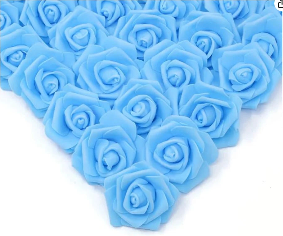 A cluster of light blue artificial foam rose decorations arranged in a heart shape.