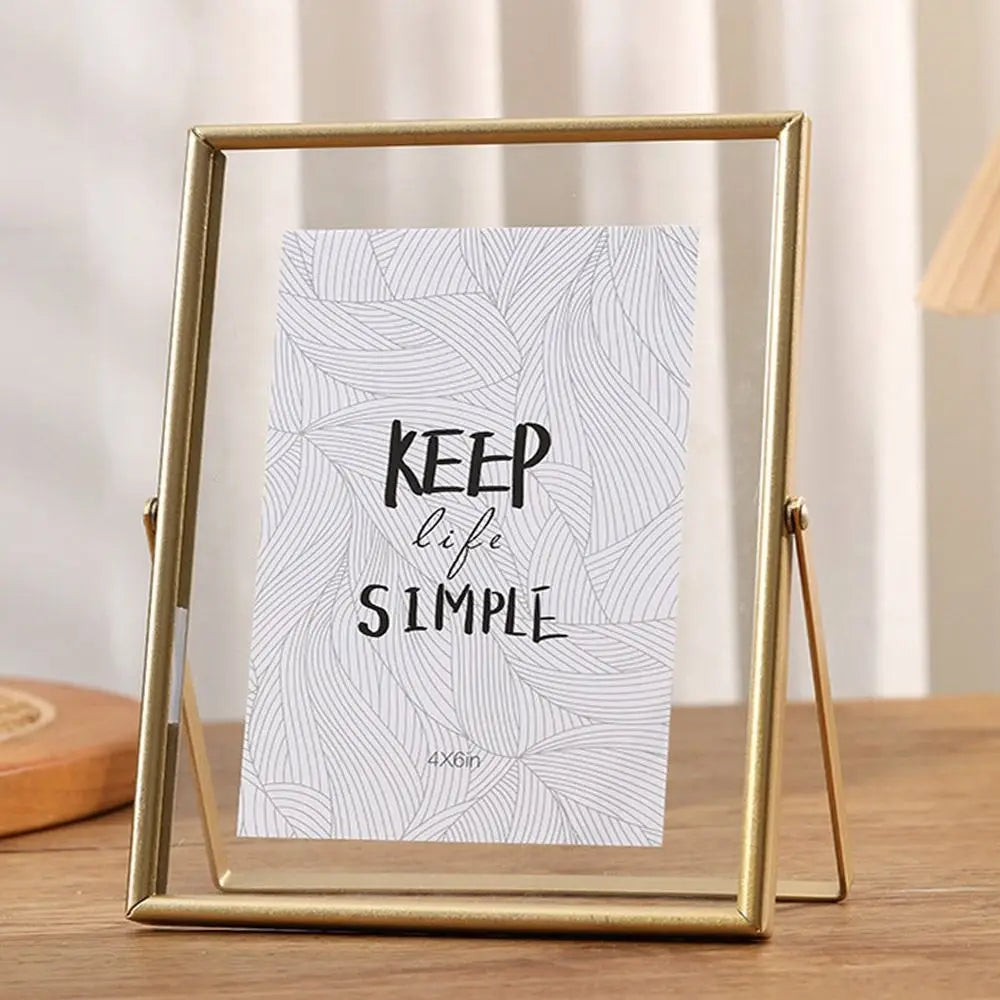 A rectangular gold-framed photo display featuring a card with the text Keep life simple on a white background.