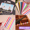 A collection of colorful PVC photo corner protectors in various stripes and solid colors for scrapbooking and albums.