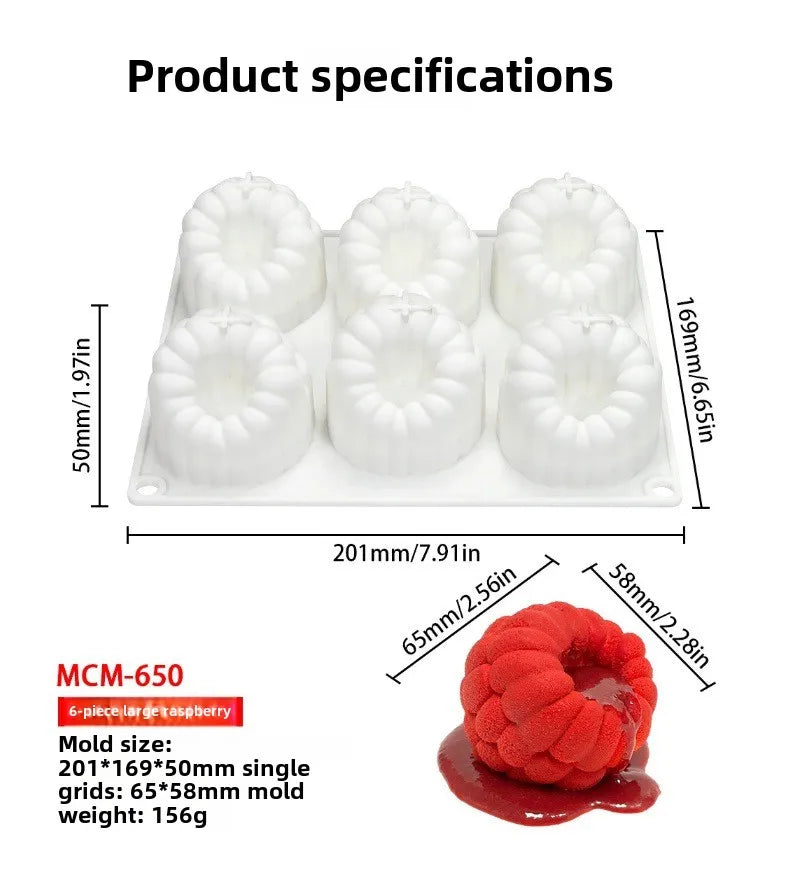 White silicone mold with six cavities for making raspberry mousse or fruit desserts.