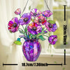A purple and pink acrylic flower pot sun catcher ornament hanging by a chain, featuring vibrant floral designs.