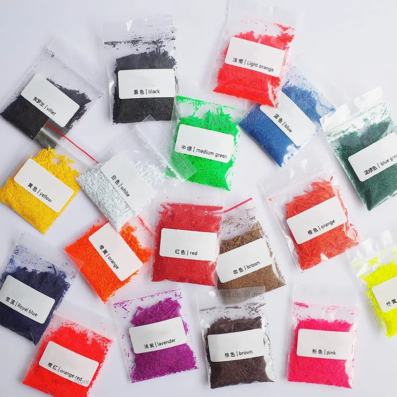 Assortment of vibrant, finely ground eco-friendly soy candle dye colorants in various shades including black, red, orange, gr