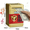 A gold and red ATM-style piggy bank with an electronic lock is shown dispensing a stack of US dollar bills.