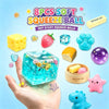 A hand holds an assortment of 8 pieces of soft squeeze balls including a yellow ball, a strawberry, and a purple glitter ball