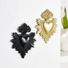 Two heart-shaped resin wall decorations, one black and one gold, featuring textured edges.