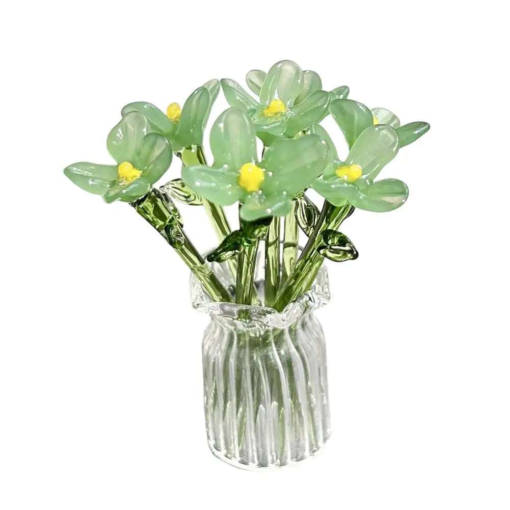 Hand-blown glass flower bouquet featuring light green blossoms in a clear glass vase