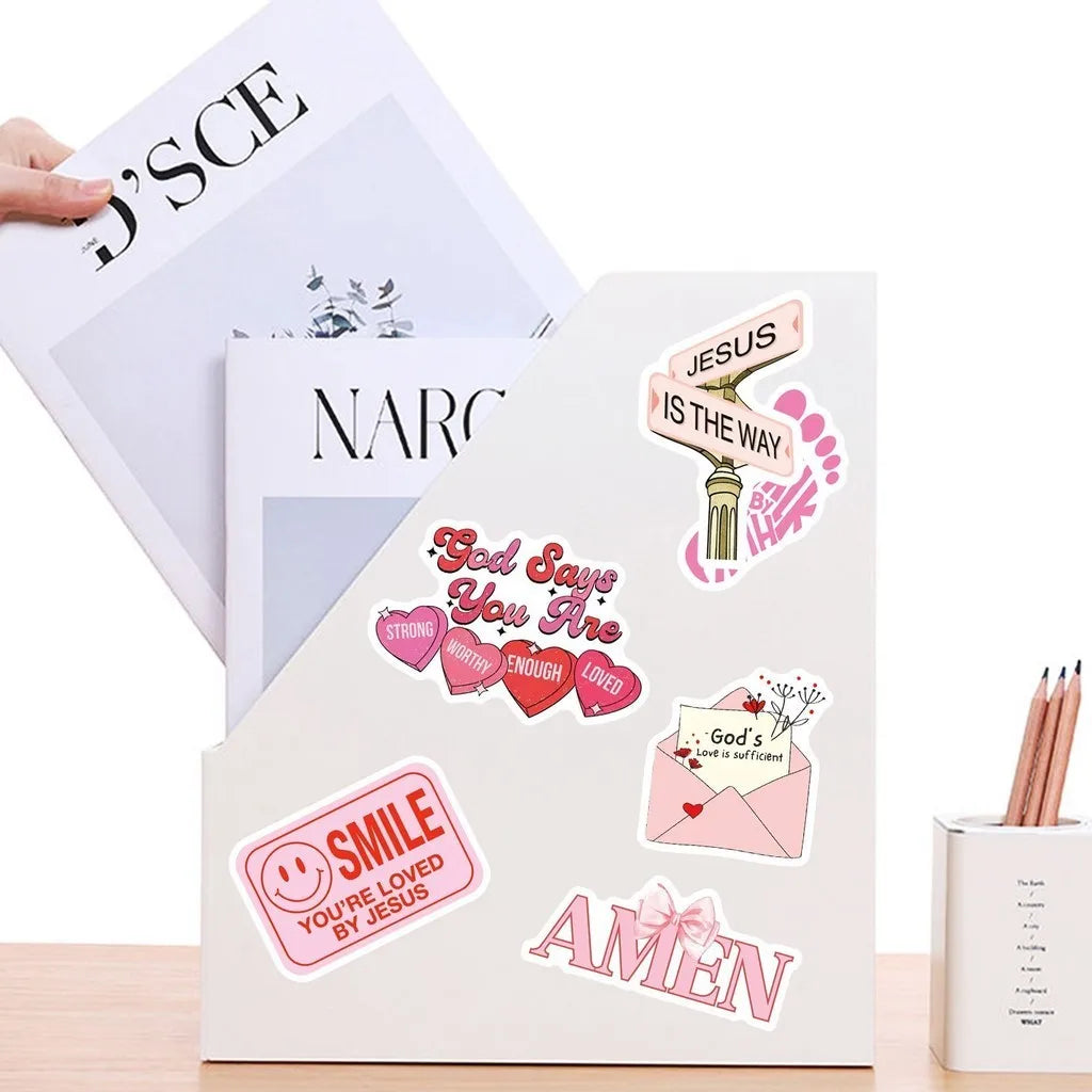 A set of Jesus phrase graffiti stickers on a white card with motivational messages like God says you are strong worthy loved 