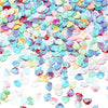 A pile of iridescent sea shell PVC sequins in various pastel colors like pink, blue, and yellow for nail art and craft decora