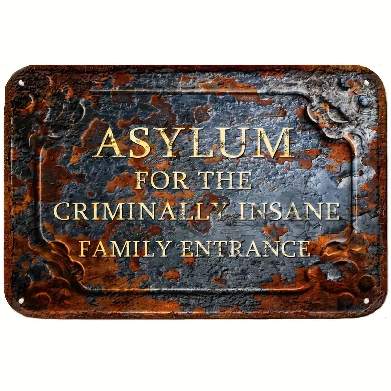 A rectangular, distressed metal sign with gold lettering that reads Asylum for the Criminally Insane Family Entrance