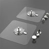 A set of clear adhesive wall hooks with mounting hardware shown on a gray background.