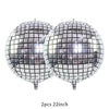 A pair of metallic silver disco ball balloons, 22 inches each.