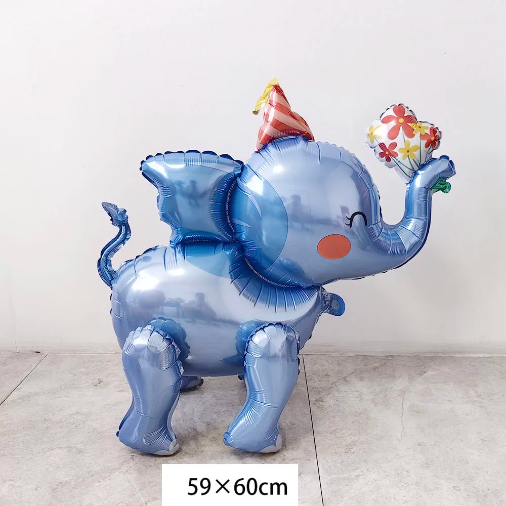 Blue inflatable elephant decoration with a striped party hat and floral accents for birthday celebrations