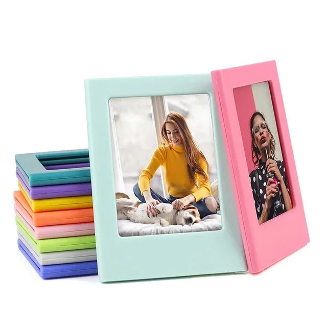 Two magnetic photo frames, one mint green and one pink, display a woman and a cat.