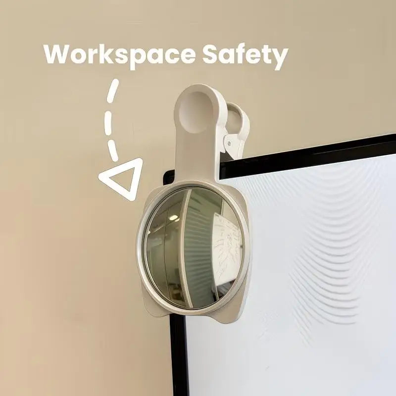 A beige convex mirror mounted on a wall, used for workspace safety.